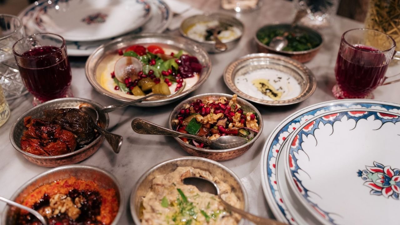 A spread of small mezze dishes and drinks on a table