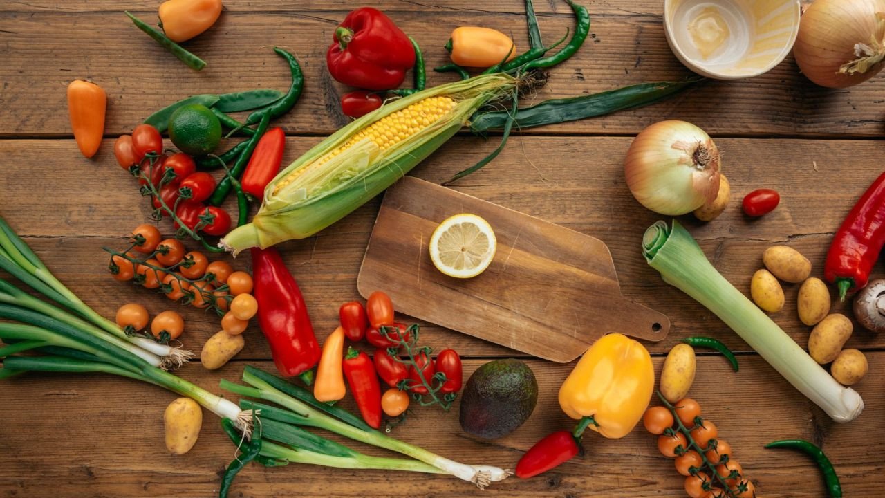 Fresh vegetables and fruit on a wooden table