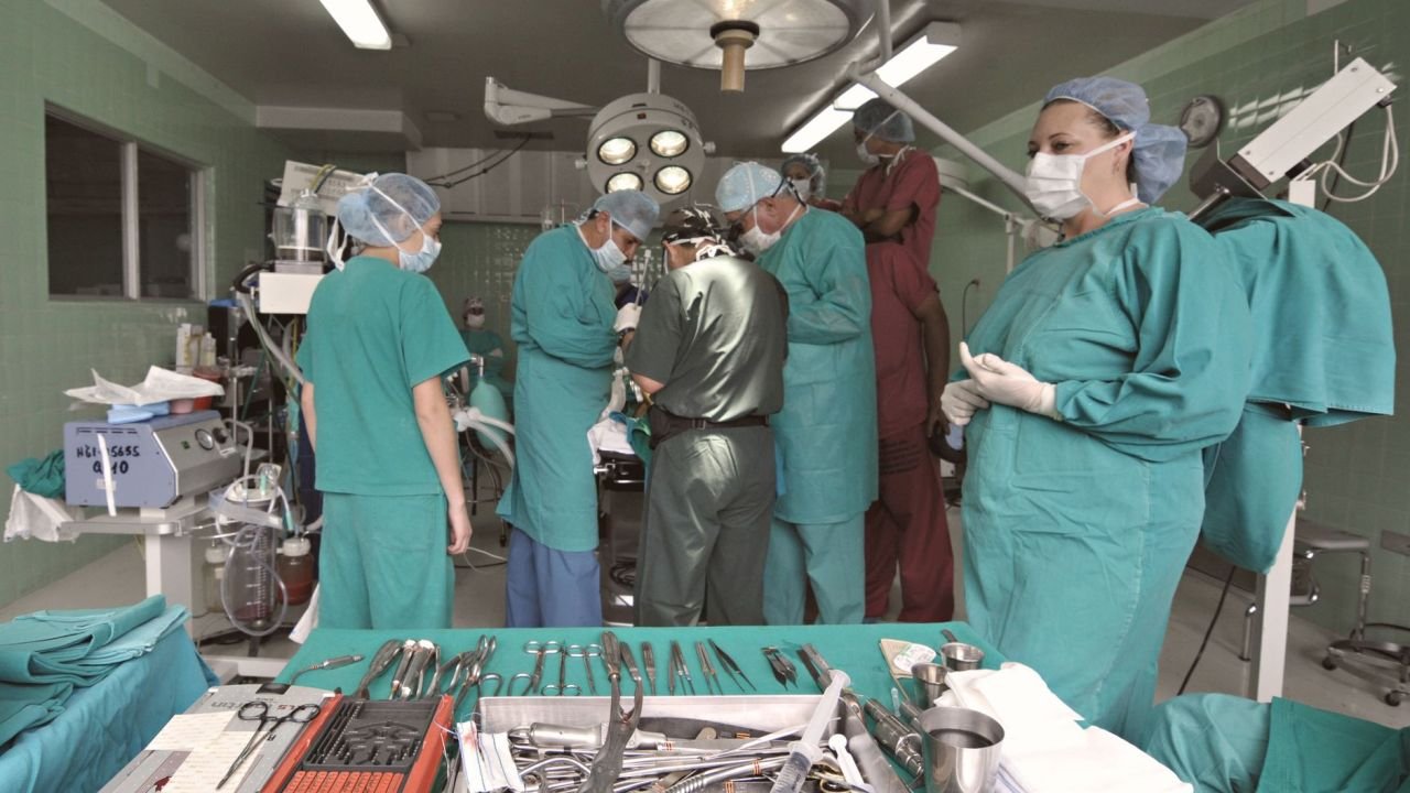A surgical team at work in an operating theatre